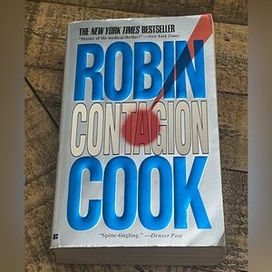 paperback copy of the medical thriller novel Contagion by Robin Cook